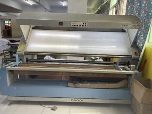 Fabric inspecting machine