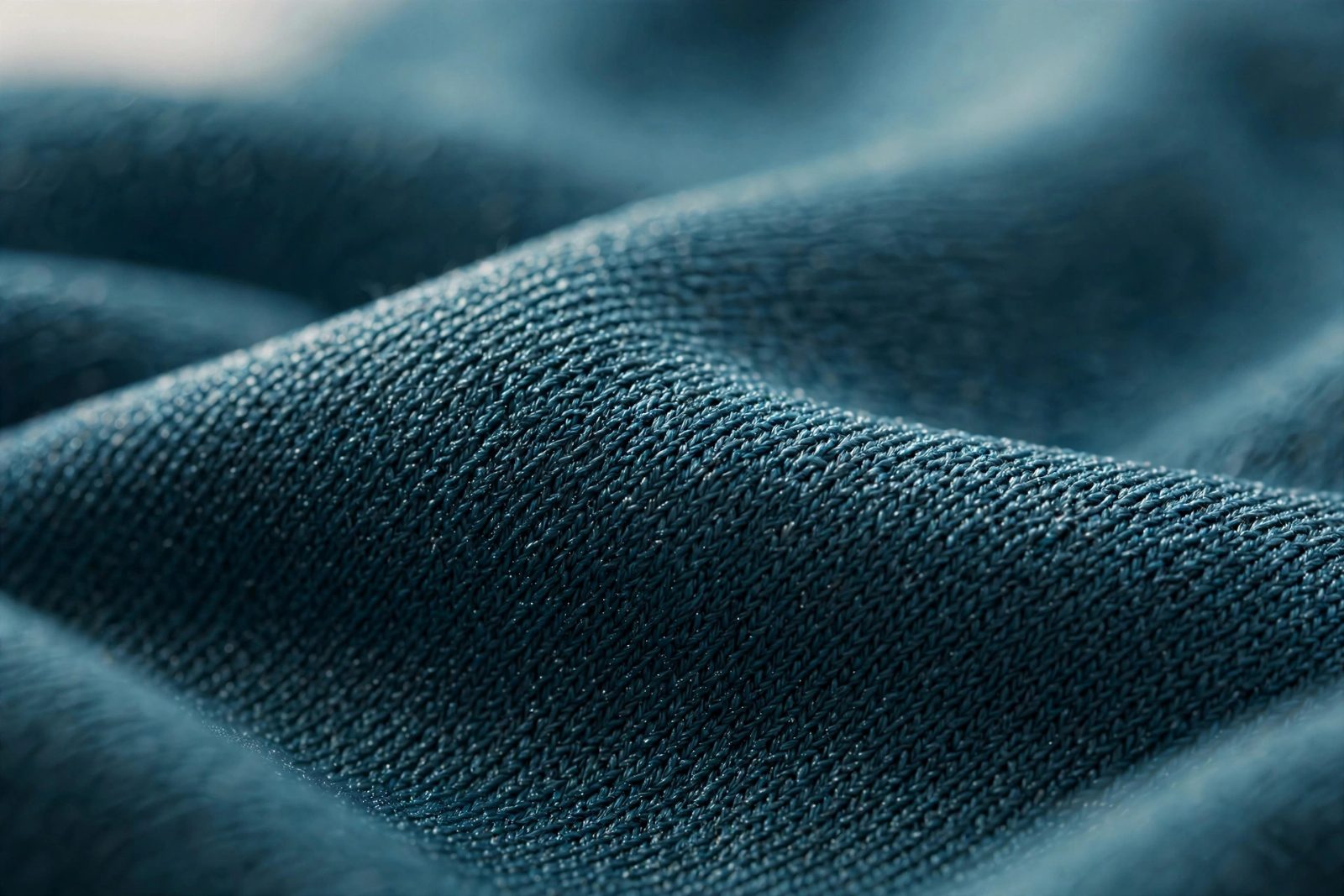 Macro close-up of quick-dry stretch swim fabric used in modest swimwear production