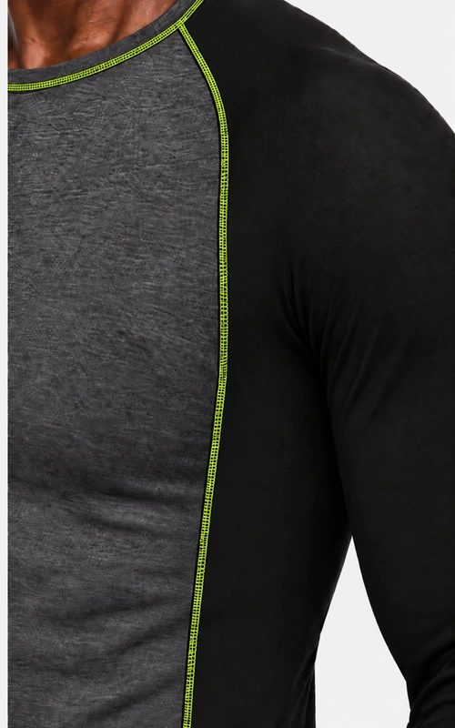 Neckline detail of men's charcoal training set with fluorescent lime contrast stitching