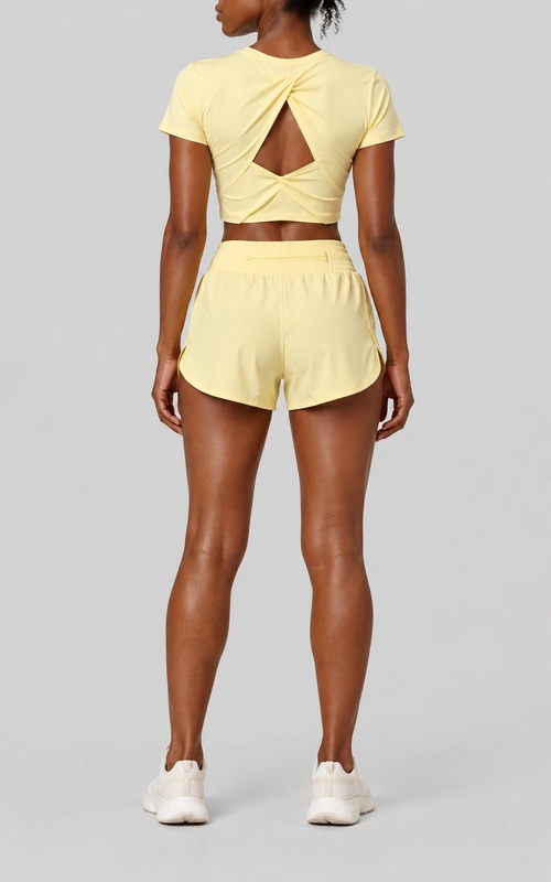 Women's twist-back crop top and running shorts set back view