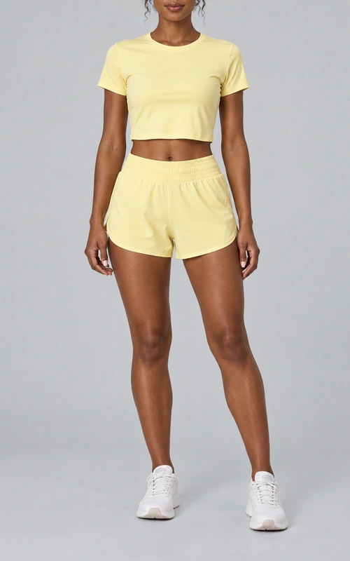 Women's twist-back crop top and running shorts set front view