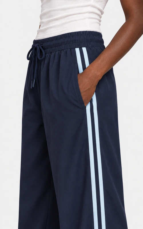 Women's side stripe wide leg track pants detail view